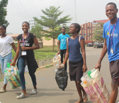 Image of members of Enactus Futa carrying a clean up exercise